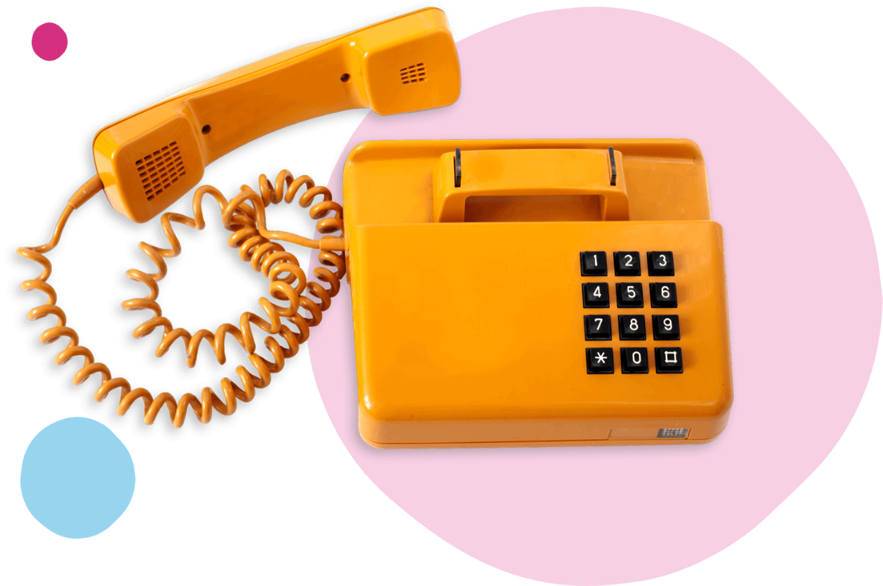 Corded yellow telephone in front of pink and blue irregular circles.